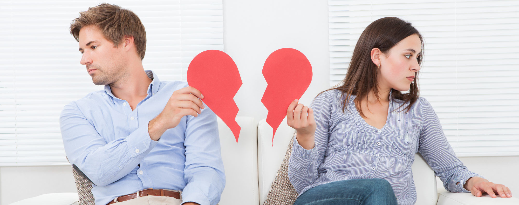 Marriage Annulment; women and man sitting with broken paper heart