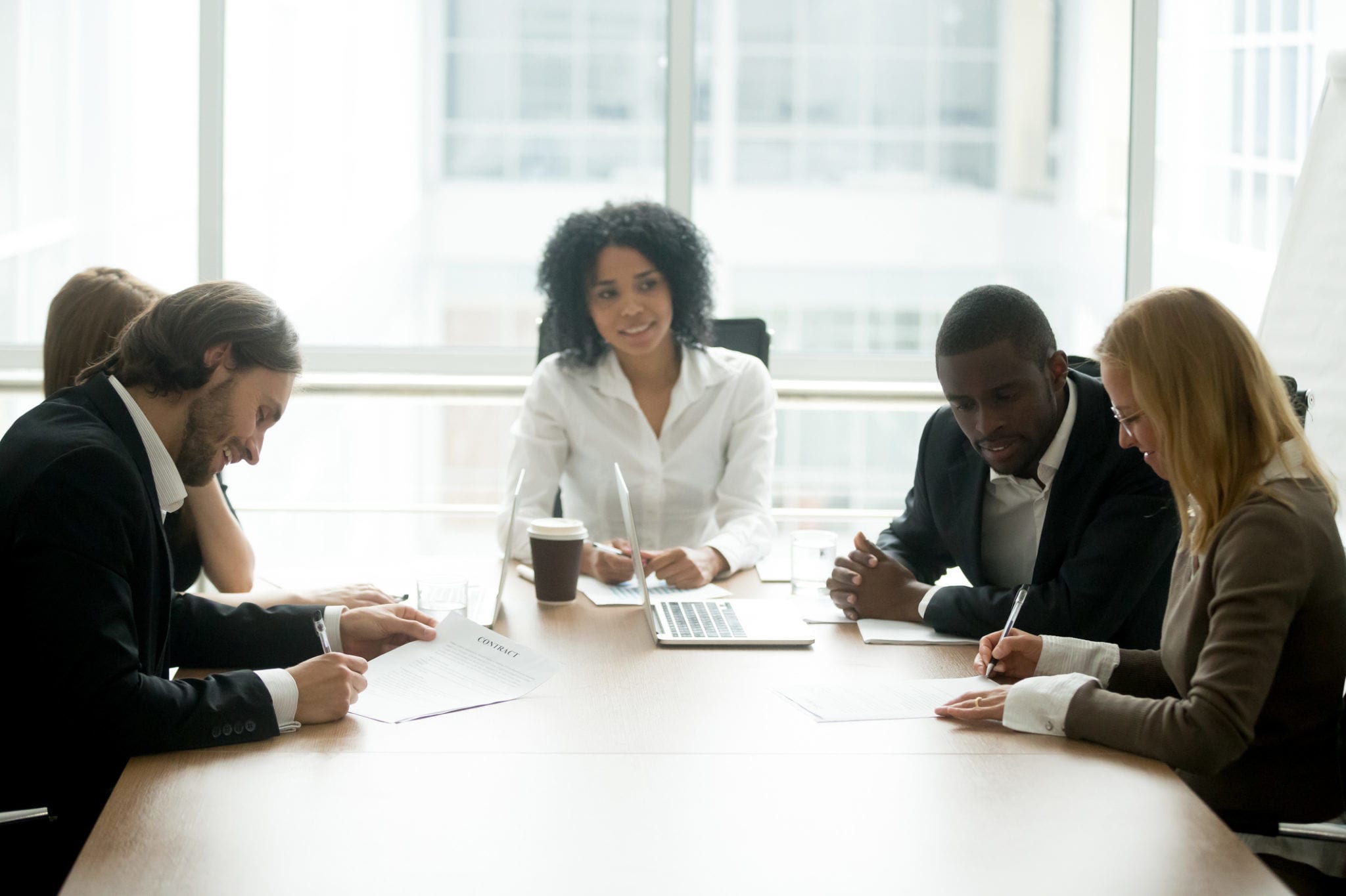 Couple with attorneys meeting a mediator in Collaborative Divorce Session