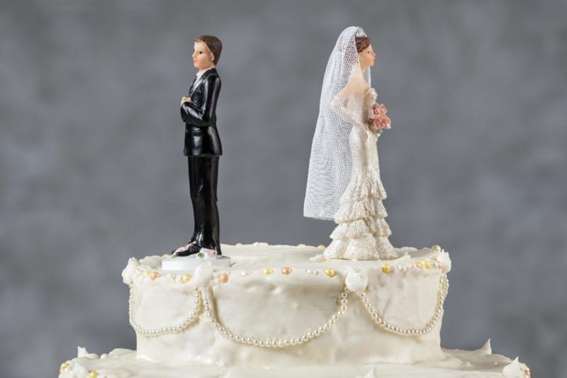 Wedding cake topper bride and groom back to back angry